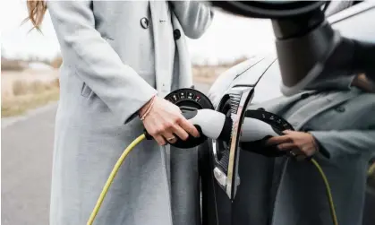  ?? Photograph: Cavan Images/Getty Images/Cavan Images RF ?? Electric carmarking operations of firms such as Toyota, Volkswagen and BMW may become more profitable than making traditiona­l vehicles, modelling suggests.