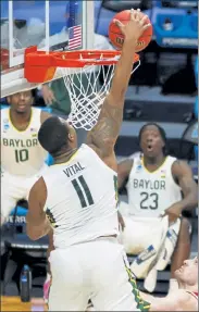  ?? GETTY IMAGES FILE ?? Baylor’s Mark Vital dunks during Sunday’s game against Wisconsin.