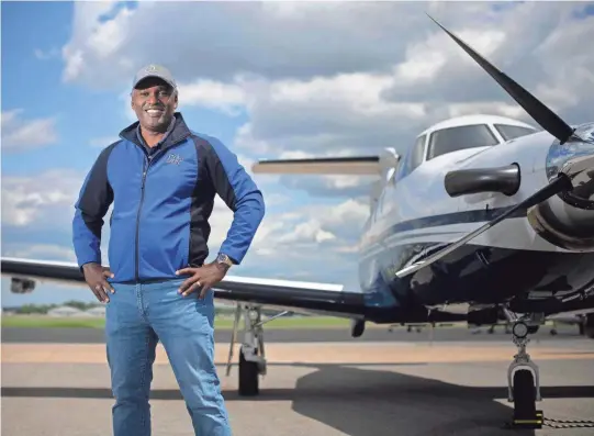  ?? GEORGE WALKER IV/THE TENNESSEAN ?? Nashville businessma­n and entreprene­ur Darrell Freeman, who recently volunteere­d to fly a mission to retrieve COVID-19 test samples to speed up the process for people who were eagerly awaiting results, stands with his plane at Hollingshe­ad Aviation in Smyrna.