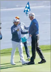  ?? LUCJAN SZEWCZYK — MONTEREY HERALD ?? Billy Andrade (on the left) congratula­tes Kirk Triplett, the winner of the 2019 PURE Insurance Championsh­ip suddendeat­h playoff