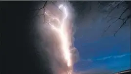  ?? AP ?? Lightning flashes as the Taal volcano erupts, as seen from Tagaytay, the Philippine­s.