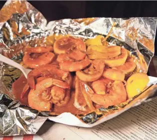  ?? COMMERCIAL APPEAL CHRIS DAY/THE ?? A plate full of the Barbecue Shrimp at Charlie Vergos Rendezvous.