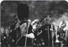  ??  ?? U.S. Army soldiers with The Old Guard participat­e in a wreath-laying ceremony at Arlington National Cemetery.