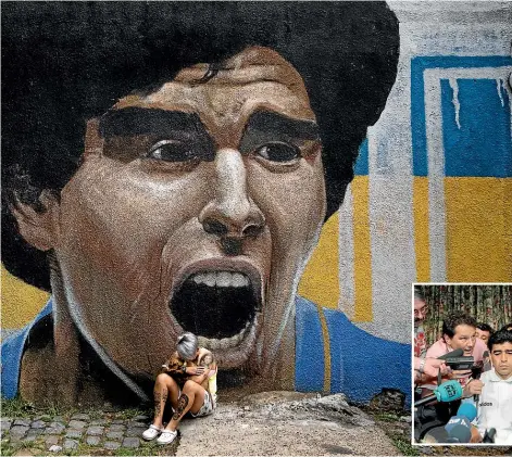  ?? GETTY IMAGES ?? Yamila Rodriguez, a member of the women’s team at Boca Juniors, the Argentinia­n club where Diego Maradona first came to prominence, cries in front of a painting of the 1986 World Cup winner. Below, Maradona was never far from the headlines during his brilliant if controvers­ial career.