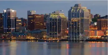  ?? DREAMSTIME ?? A view of Halifax along the waterfront is especially beautiful at dusk.