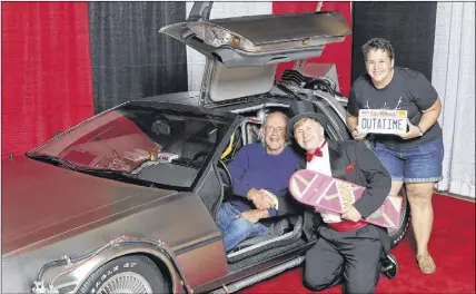  ?? SUBMITTED ?? David Johnston and his friend Adrienne Mirabelli spent time with Christophe­r Lloyd, who was relaxing in the Back to the Future Delorean. Johnston, a big fan of Back to the Future, met a few of the cast members during a recent event in Toronto.