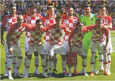  ?? ASSOCIATED PRESS FILE PHOTO ?? The Croatia team poses June 3 for photograph­ers prior to the friendly match against Brazil in Liverpool, England.