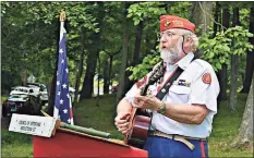  ?? Hearst Connecticu­t Media file photo ?? Tom Callinan, a Middletown native, was Connecticu­t’s first state troubadour. Here, he sings during a dedication to of the Sgt. Stubby statue at the Connecticu­t Trees of Honor in Middletown.