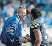  ?? ELAINE THOMPSON THE ASSOCIATED PRESS ?? Seattle rapper Macklemore, left, and Seahawks quarterbac­k Russell Wilson are now part-owners of the Seattle Sounders soccer team.