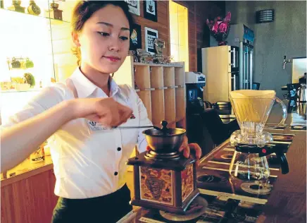  ?? Photo: REUTERS ?? A North Korean staffer prepares a coffee at a cafe in central Pyongyang.