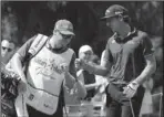  ?? The Associated Press ?? KRAFT-WORK: Kelly Kraft, right, gives his caddie a fist bump Saturday after a chip in birdie on the 11th hole during the third round of the Military Tribute at The Greenbrier golf tournament in White Sulphur Springs, W.Va.