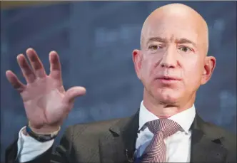  ?? The Associated Press ?? Jeff Bezos, Amazon founder and CEO, speaks at The Economic Club of Washington recently. Bezos says the National Enquirer is threatenin­g to publish nude photograph­s of him unless his private investigat­ors back off their own investigat­ion of the tabloid.