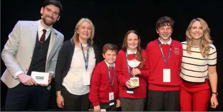  ??  ?? Students Ros Ó Tuama, Sarah Chaomhána, Jack O’Broin, and their teacher Helena Ní Fhloinn de Róiste from Gaelscoil Inis Córthaidh are pictured at the 2017 Bord Gáis Energy Student Theatre Awards in Dublin.