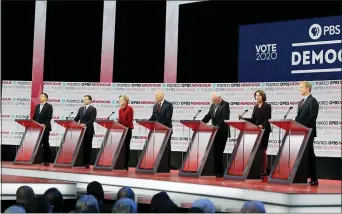  ?? CHRIS CARLSON — THE ASSOCIATED PRESS ?? Democratic presidenti­al candidates from left, entreprene­ur Andrew Yang, South Bend Mayor Pete Buttigieg, Sen. Elizabeth Warren, D-Mass., former Vice President Joe Biden, Sen. Bernie Sanders, I-Vt., Sen. Amy Klobuchar, D-Minn., and businessma­n Tom Steyer stand on stage during a Democratic presidenti­al primary debate Thursday in Los Angeles.