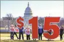  ?? J. Scott Applewhite Associated Press ?? ACTIVISTS appeal for a $15 federal minimum wage near the U.S. Capitol.