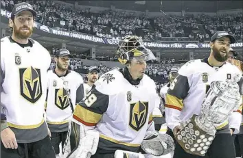  ?? Trevor Hagan/Associated Press ?? James Neal, left, Marc-Andre Fleury and Deryk Engelland, all former Penguins and now members of the Vegas Golden Knights, skate off the ice with the Clarence S. Campbell Bowl after winning the Western Conference final Sunday against Winnipeg.