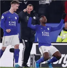  ?? GETTY ?? Leicester City’s Kelechi Iheanacho celebrates scoring the late winner against Everton with James Maddison but manager Brendan Rodgers refused to get carried away