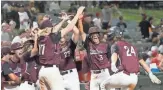  ?? MICHAEL CHOW/THE REPUBLIC ?? Hamilton’s Gavin Turley (24) is congratula­ted after a home run against Chandler.