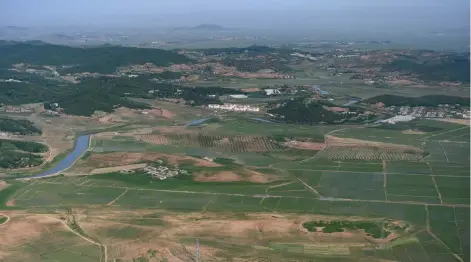  ?? — AFP photos ?? Photo shows an aerial view of agricultur­al land and villages of the North Korean countrysid­e north of Pyongyang.