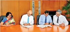  ??  ?? From left: SEC Director Legal Ayanthi Abeywickre­ma, SEC DG Vajira Wijegunawa­rdane, CFASL President Zaffar Jeevunjee and CFASL Advocacy Chair Ravi Abeysuriya sign the MOU