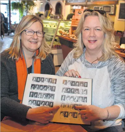  ?? KATIE SMITH/THE GUARDIAN ?? Pam Bissonette and Nancy Wilson point out their school pictures from their Richmond Hill High School yearbook. The women, who hadn’t seen each other since they were 15 years old, have recently reunited.