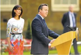  ?? MATT DUNHAM/ASSOCIATED PRESS ?? With his wife Samantha Cameron looking on, Britain's Prime Minister David Cameron announced outside 10 Downing Street in London on Friday that he would resign following the U.K. vote to leave the European Union. Cameron had supported staying in the bloc.