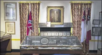  ??  ?? A portrait of Confederat­e Gen. Robert E. Lee hangs in the First White House of the Confederac­y, across the street from Alabama’s state Capitol in Montgomery.