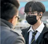  ?? KEVIN STENT/STUFF ?? Wellington College year 13 student Jimin Kim arrives back at school after lockdown.