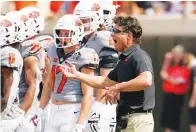  ?? The Associated Press ?? ■ Oklahoma State head coach Mike Gundy gestures during a timeout in the second half of an NCAA football game against Tulsa Saturday in Stillwater, Okla.