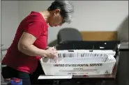  ?? KEITH SRAKOCIC - THE ASSOCIATED PRESS ?? An election worker continues the process in counting ballots for the Pennsylvan­ia primary election, Wednesday, at the Mercer County Elections Board in Mercer, Pa. Vote counting continues as Republican candidates Dr. Mehmet Oz and David McCormick are locked in a too-early-tocall race for Pennsylvan­ia’s hotly contested Republican nomination for an open U.S. Senate seat.