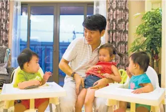  ?? ALY SONG/ REUTERS ?? Tony Jiang lives in Shanghai. He and his wife employed an American surrogate to have their daughter, born in California, and later for their twins. The increased interest from Chinese parents has created cultural tensions.