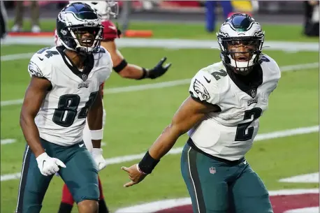  ?? RICK SCUTERI — THE ASSOCIATED PRESS ?? Eagles quarterbac­k Jalen Hurts (2) celebrates his touchdown against the Arizona Cardinals during the second half.