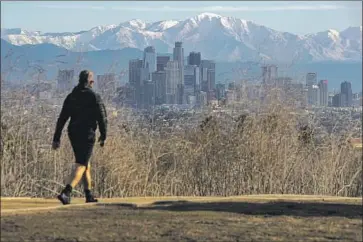  ?? Irfan Khan Los Angeles Times ?? SNOW-CAPPED mountains can be seen from the Hahn State Recreation Area last month. Temperatur­es across Southern California may reach the mid-60s to lower 70s this week as an area of high pressure moves in.