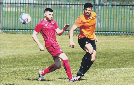  ??  ?? COUNTY CLASH: Lloyd Henderson is put under pressure by a Boro Rangers opponent during Saturday’s North Riding FA County Cup quarter-final clash