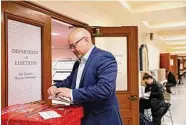  ?? Lea Suzuki/The Chronicle ?? John Hamasaki, who challenged Brooke Jenkins for district attorney, votes at City Hall in San Francisco.