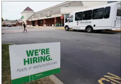  ?? (AP/Steve Helber) ?? A Publix supermarke­t in Richmond, Va., announces job openings earlier this month. The number of Americans applying for unemployme­nt benefits rose last week for the first time since April despite evidence that the economy and the job market are rebounding from the pandemic recession.