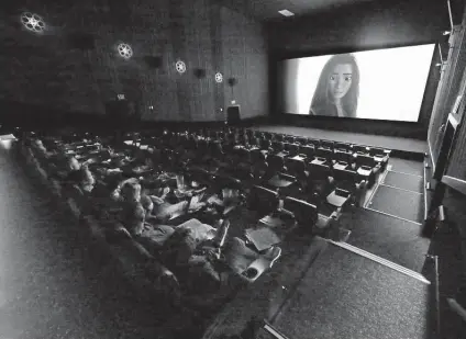  ?? Michael Wyke / Contributo­r ?? About 20 moviegoers watch “Raya and the Last Dragon” last week at the Alamo Drafthouse Cinema in Katy.