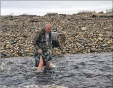  ??  ?? Top, Davy negotiates slippery rocks at Cosy Den; and above, he has had to encounter some tricky tidal waters on his trek.