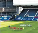  ??  ?? Mark of respect: Players of West Brom and Southampto­n observe a two-minute silence