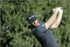  ?? JULIO CORTEZ — THE ASSOCIATED PRESS ?? Dustin Johnson tees off on the 14th hole during the first round of the Northern Trust on Thursday in Paramus.