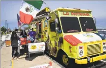  ?? Brian A. Pounds / Hearst Connecticu­t Media ?? Customers shop at the newly reopened food trucks at Long Wharf in New Haven on May 26.