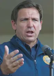  ?? JOE RAEDLE/GETTY ?? Gov. Ron DeSantis, a Republican, speaks during a news conference in Cape Coral on Oct. 4.