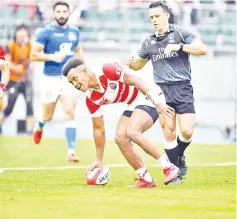  ??  ?? Japan’s fullback Kotaro Matsushima scores a try during the rugby union Test match between Japan and Italy at the Oita Bank Dome in Oita on June 9, 2018. — AFP photo