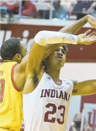  ?? DARRON CUMMINGS/ AP ?? Indiana forward Trayce Jackson- Davis ( 23) is fouled by Maryland forward Galin Smith ( 30) during the second half of Monday’s game in Bloomingto­n, Ind.