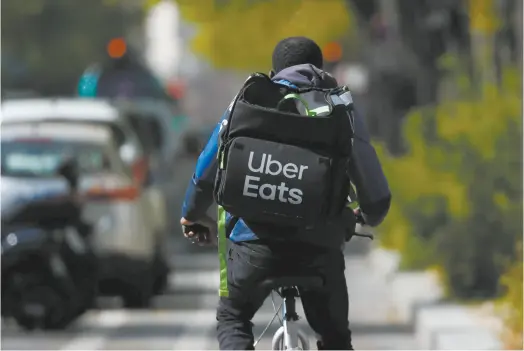  ??  ?? Uber正在快速扩张­其外卖业务Uber Eats，外卖业务在疫情中能够­较好地抵御风险视觉中­国图