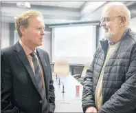  ?? MITCH MACDONALD/THE GUARDIAN ?? Stratford resident Mike Chapman, right, chats with Mayor David Dunphy following a special town council meeting Wednesday night. Chapman said he was in support of a proposed 79-unit, five-storey developmen­t on the waterfront. Council passed the first...