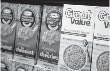  ?? REUTERS ?? Walmart private-label store brand Great Value macaroni and cheese is shelved next to Kraft's at a store in Chicago.