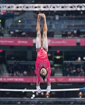  ?? Jeff Roberson Associated Press ?? SIMONE BILES, competing on the uneven bars during the Olympic trials last month, is expected to lead the Americans’ medal hopes. She won four golds and a bronze at the 2016 Games in Rio de Janeiro.