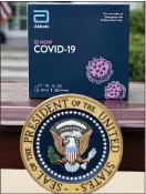  ?? ALEX BRANDON — THE ASSOCIATED PRESS ?? A 5-minute test kit for COVID-19 developed by Abbott Laboratori­es sits on a table ahead of a briefing by President Donald Trump about the coronaviru­s in the
Rose Garden of the White House, Monday in Washington.