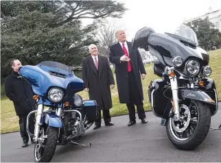  ??  ?? US PRESIDENT Donald Trump joking with reporters after greeting Harley Davidson executives and union representa­tives on the South Lawn of the White House in Washington, DC. Emblematic American motorcycle maker Harley- Davidson saw its share price dive...